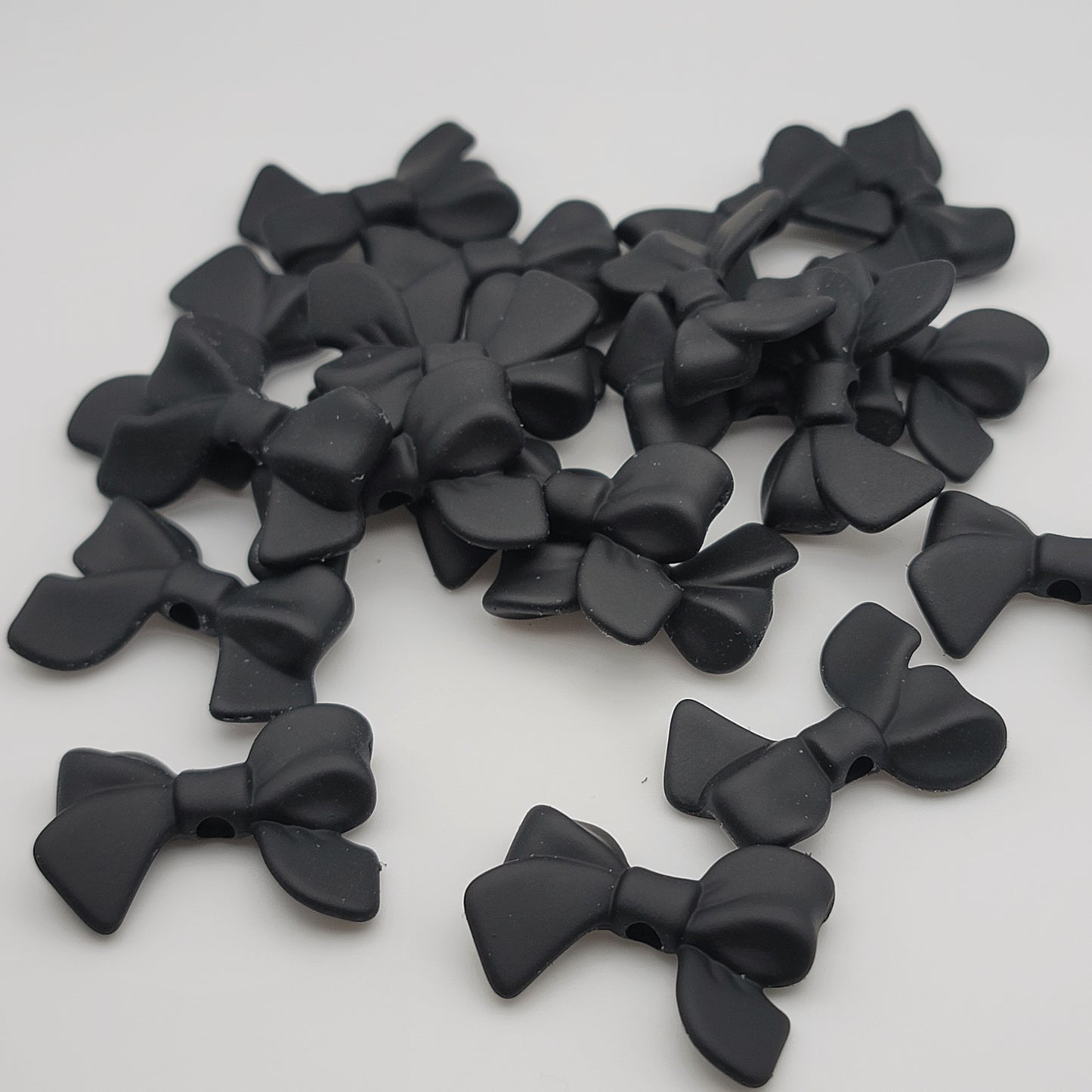 Acrylic silicone touch bow beads