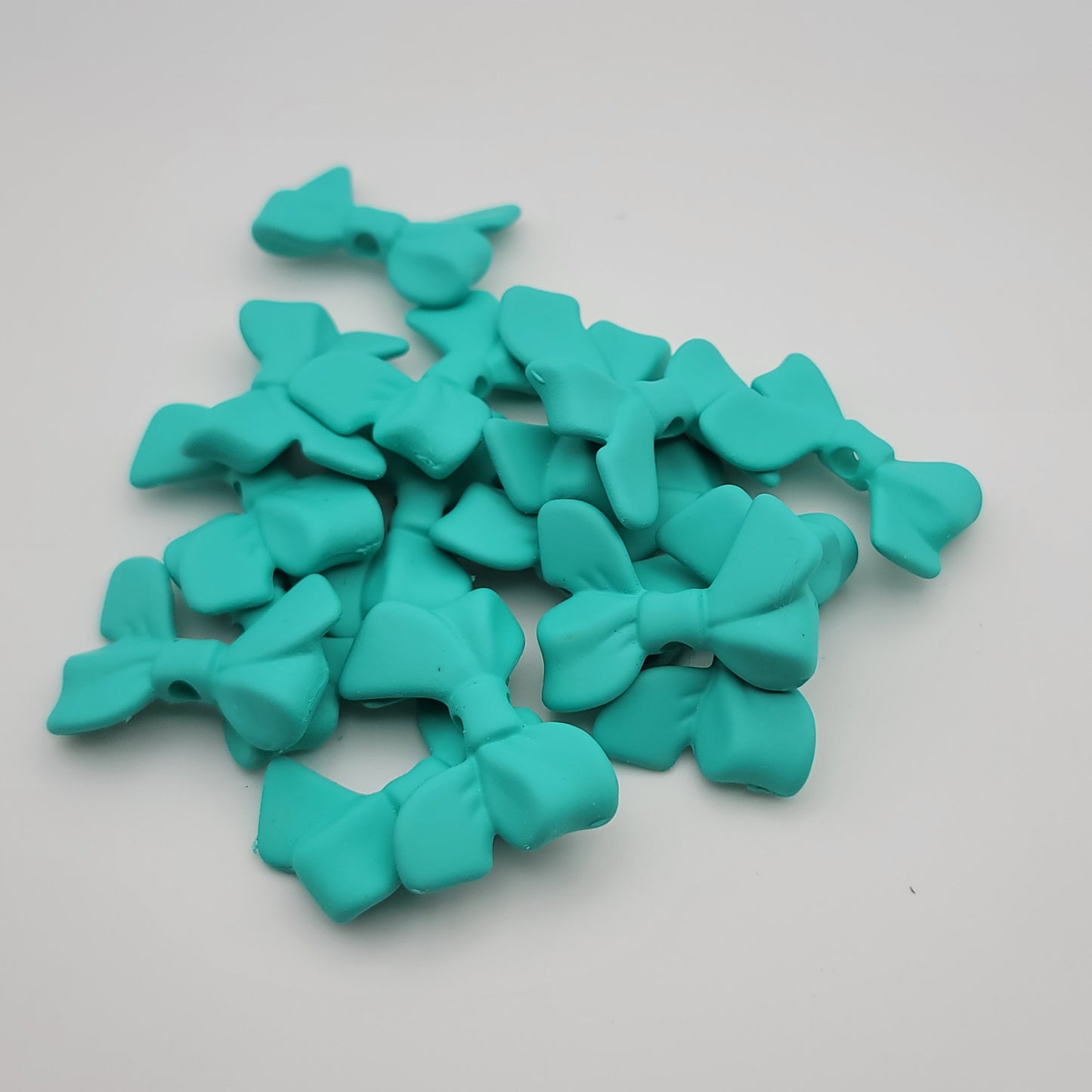 Acrylic silicone touch bow beads