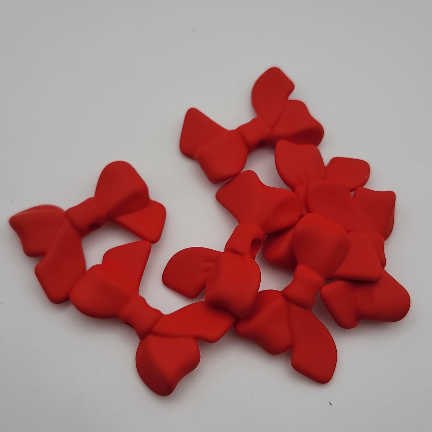 Acrylic silicone touch bow beads